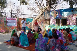 Volunteers from the Rann India Foundation teach villagers about hepatitis B testing and prevention in India.
