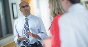 Dr. Ravi Jhaveri, an infectious disease specialist at the University of North Carolina at Chapel Hill School of Medicine, talks to parents. 