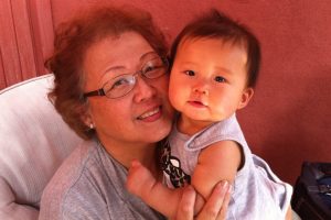 Nadine Shiroma and her grandchild.