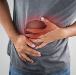man grasping his his liver